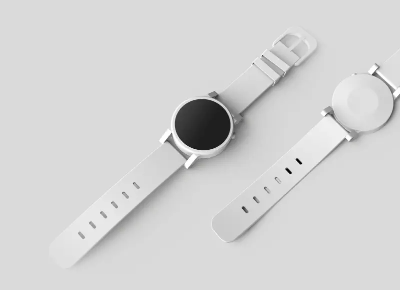 A steel dive watch with a rotating black bezel on a dark background